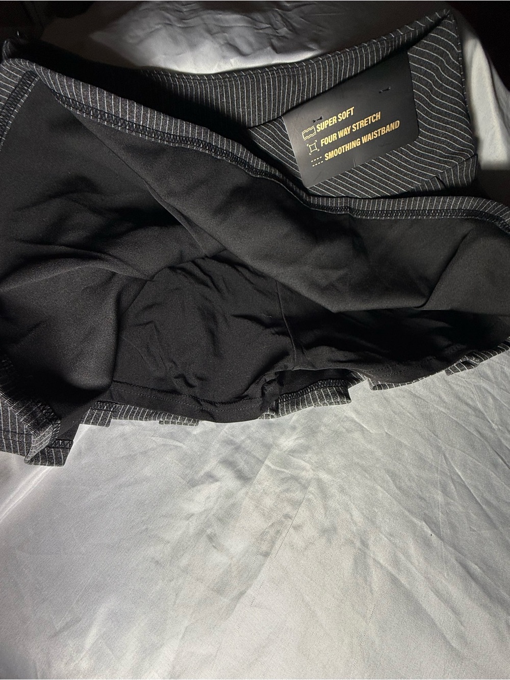Free Haven Women's Pinstripe Pleated Mini Skort with black bow accents- Black- L - Picture 6 of 7